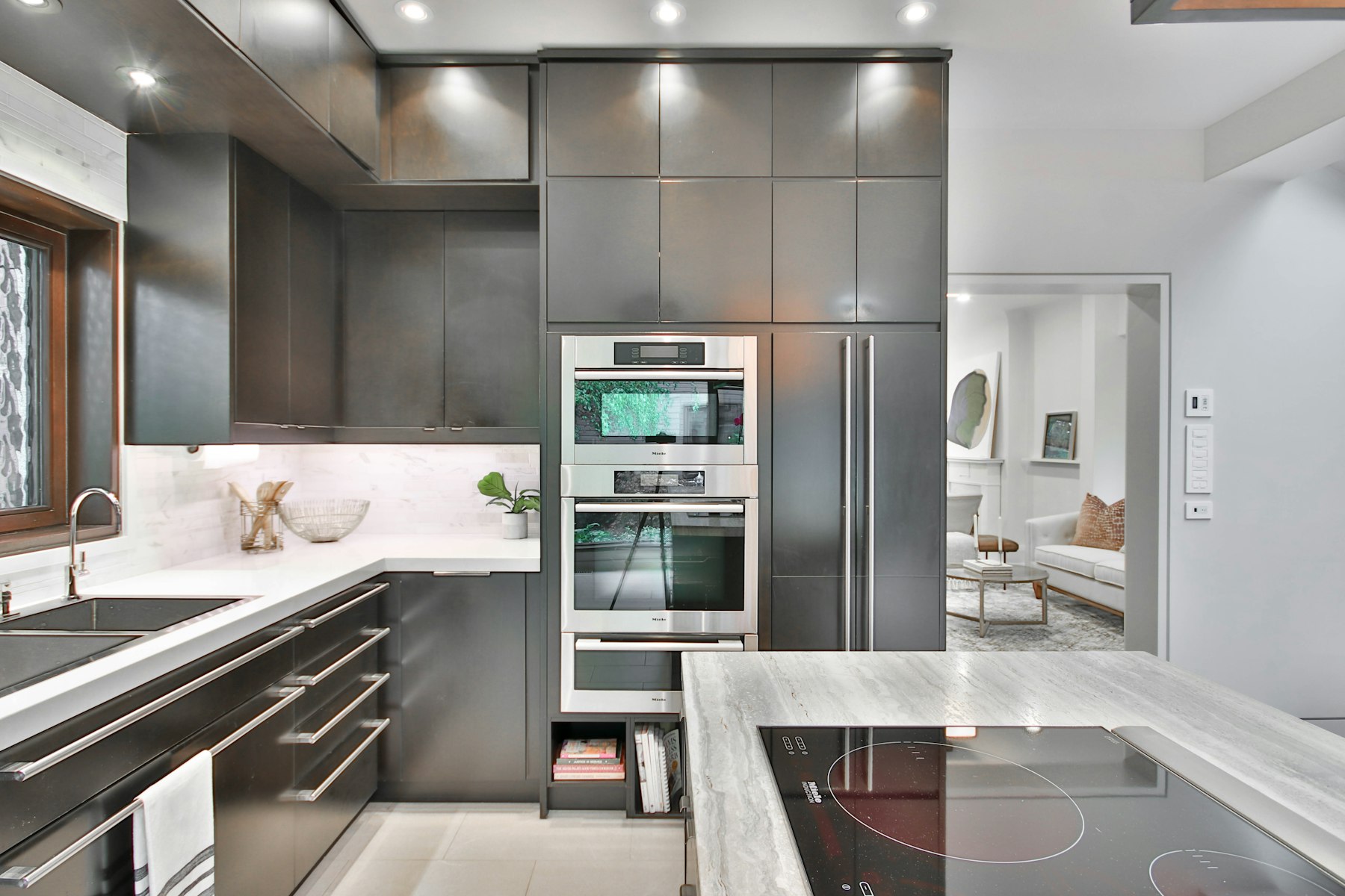 Modern kitchen with marble countertops and custom cabinetry